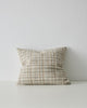 A woven cushion in creamy white, taupe and warm earthy tones - the Tripoli Fog by Weave Home nz.