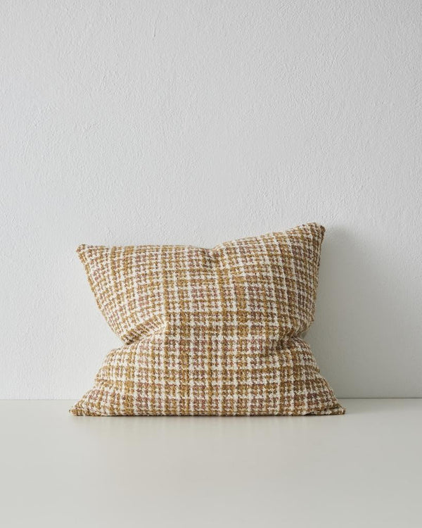 The Tripoli cushion in colour 'Terra' by Weave home - a woven cushion in earthy warm toffee-brown, white, and rose