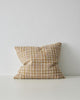 The Tripoli cushion in colour 'Terra' by Weave home - a woven cushion in earthy warm toffee-brown, white, and rose