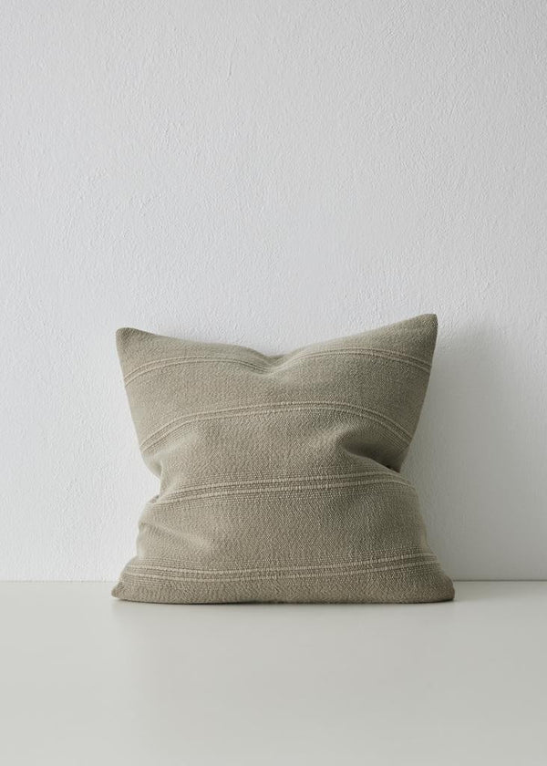 The Weave Home 'Palma' woven cushion featuring a subtle ribbed stripe, in colour 'Stone'.