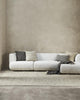 Baya Japanese-inspired designer cushions on a modern couch in a minimalist living room.