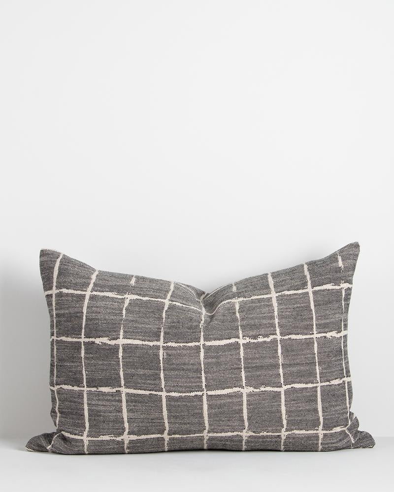 A beautiful modern lumbar cushion in black, featuring a grid design with a hand-painted look inspired byJapanese design.