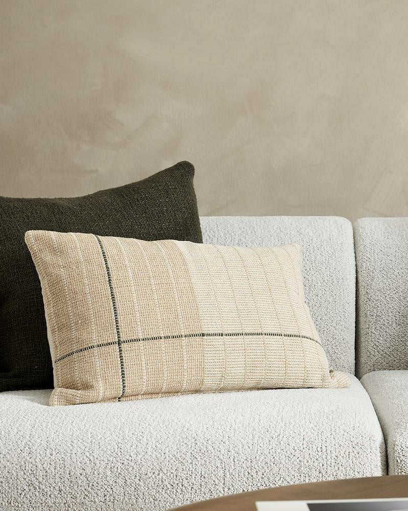 A stylish beige and off-white lumbar cushion with linear detail, the Takumi is seen here with a complementary plain cushion.