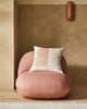 The Weave Home Erina cushion on a plump chair