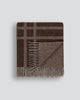 Brown modern plaid wool blanket with fringe on a light gray background