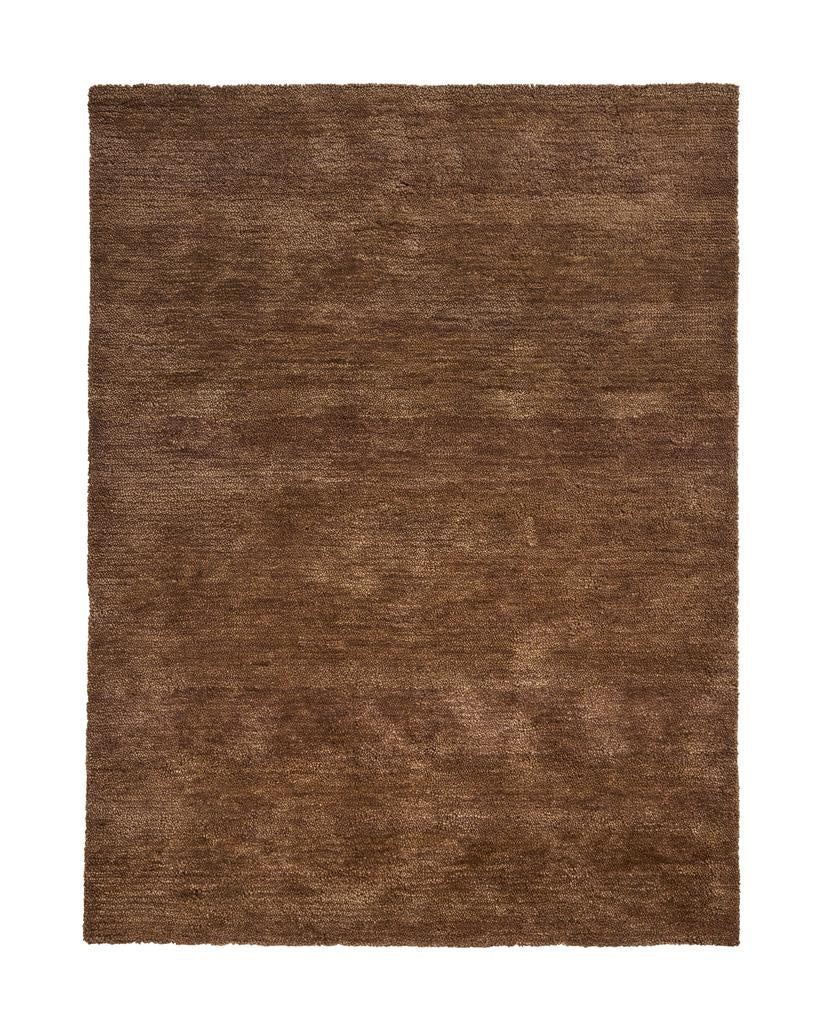 A brown, chocolate coloured wool rug with a thick, plush pile - the Valencia Toffee by Weave Home - seen in full from abive