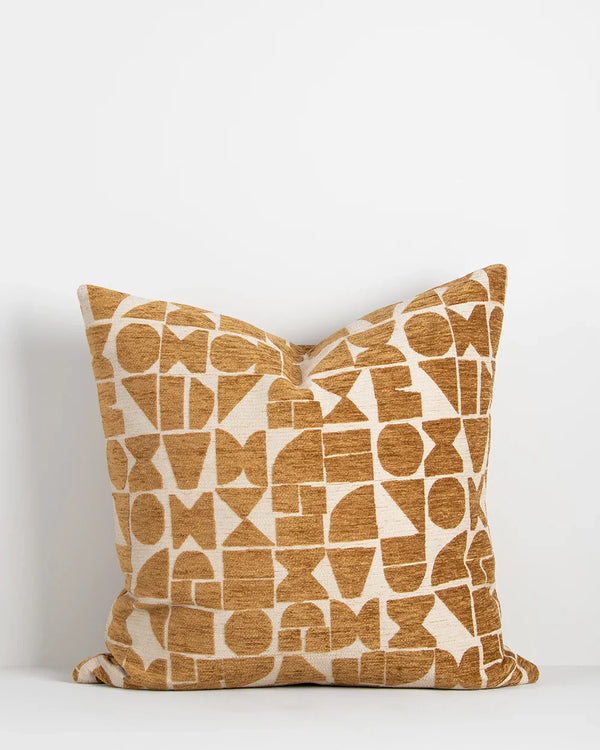 Baya geometric patterned cushion in mustard ochre tones on a cream base