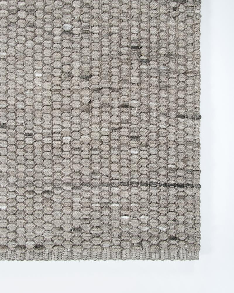 The grey Pelorus runner rug for indoors or outdoors shown close up to see the textural weave and edge detail