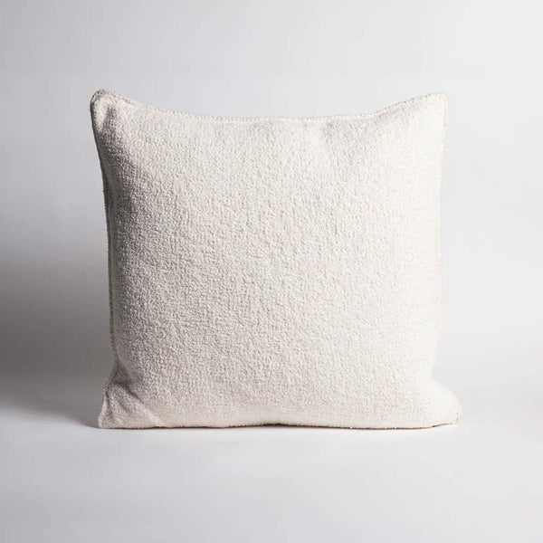 A full image of a large textural white cushion by Eadie Lifestyle 
