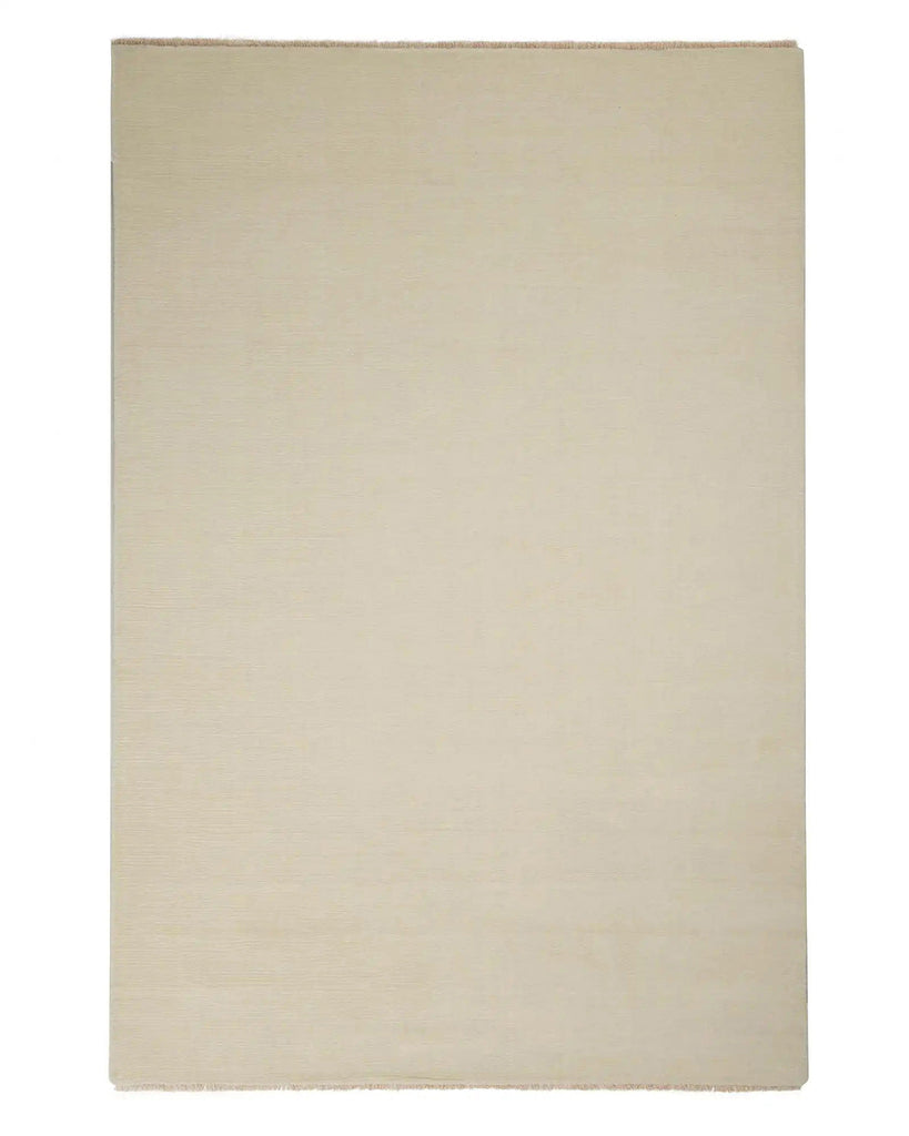A full view of a 100% wool floor rug with linear detailing in the weave, in a warm ercu tone.