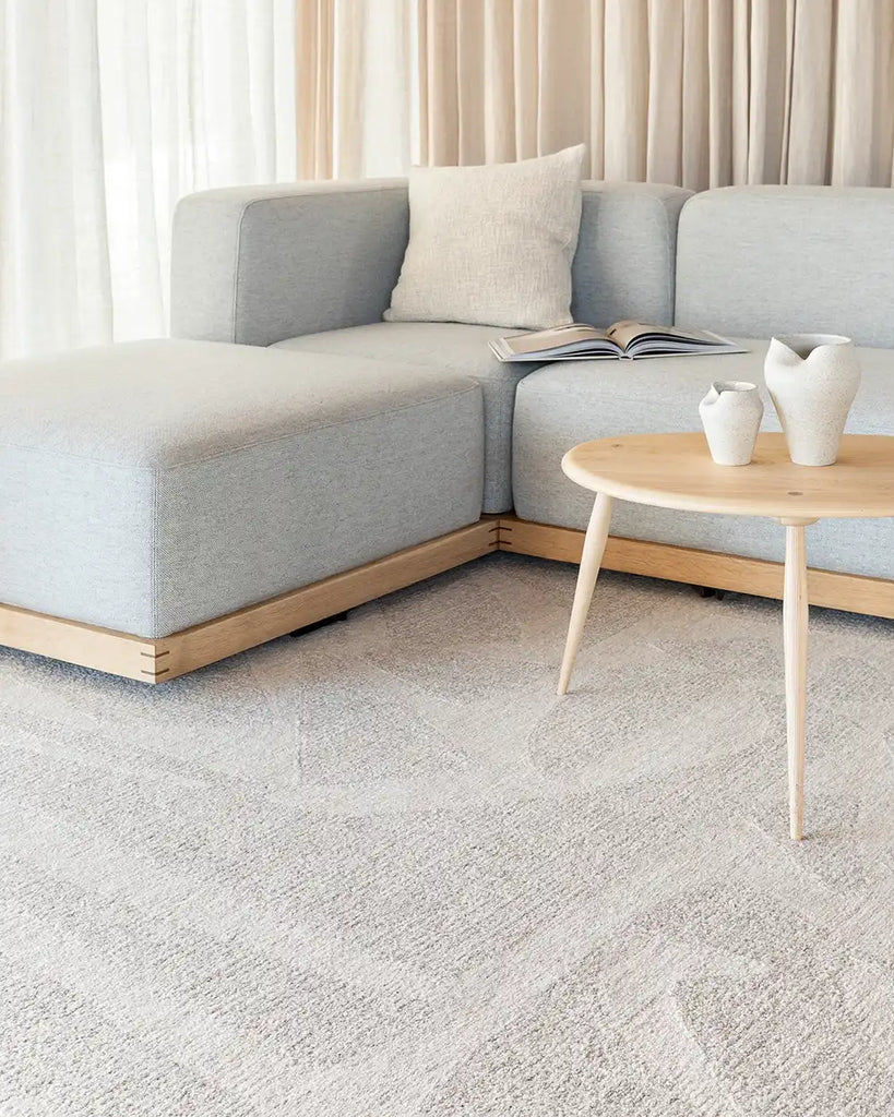 The Baya patterned wool floor rug 'Maya'  in a neutral living room