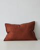 A reddish brown maroon lumbar cushion by Weave Home NZ in a linen chenille blend