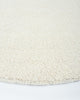 The beautiful Dorset Natural White boucle-style floor rug by Baya, seen close up in perspective