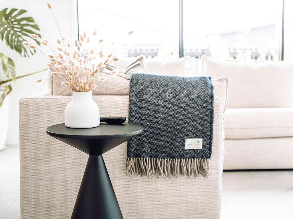 A dark blue NZ pure wool throw featuring a diamond weave pattern,made by Ruanui Station in NZ