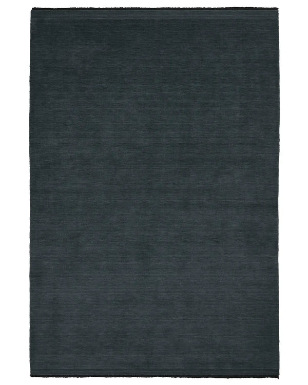 The Weave Home Silvio Rug in colour dusk, seen from above - a deep muted blue