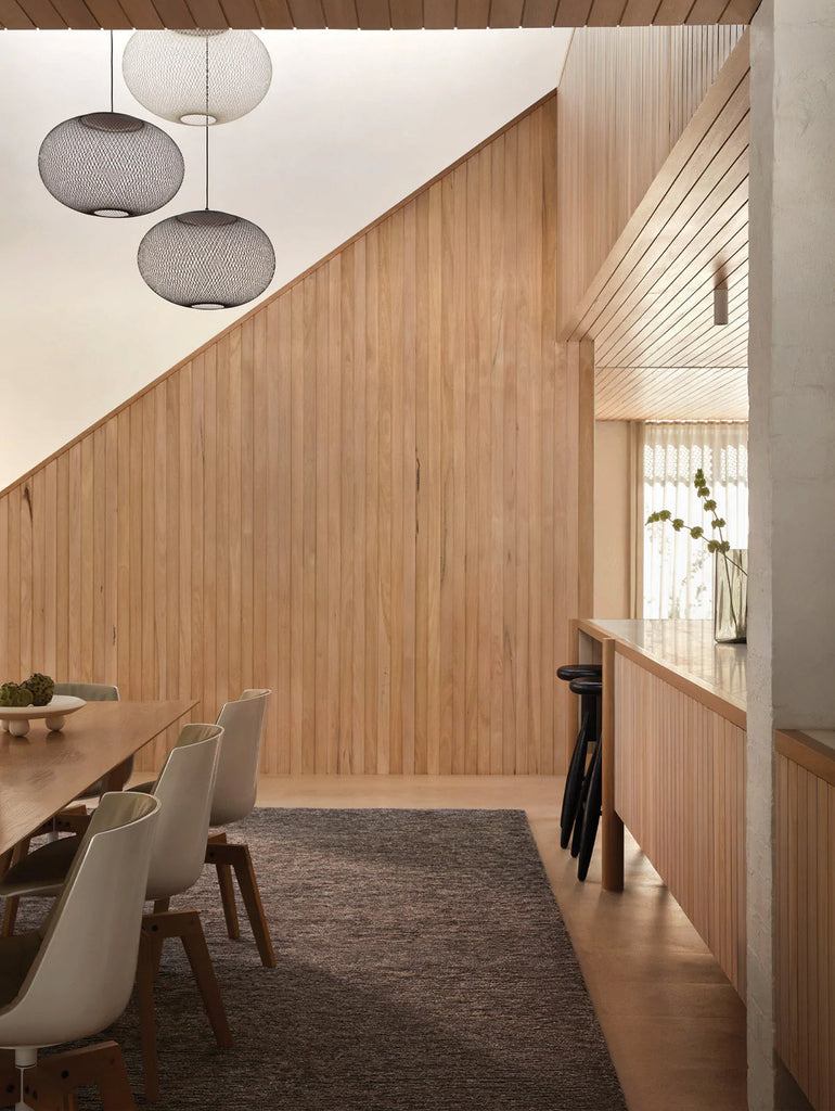 A stylish dining room featuring the Tribe Home NZ Peru wool and jute rug