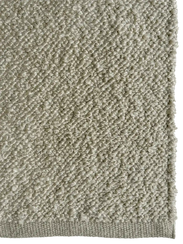 Close up of the Tribe Home Finn outdoor rug in pale green