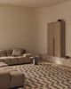 Tribe Home Chet wool and jute rug in a living room with a low modular sofa