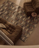 Tribe Home Orissa wool and jute rug in a living room with brown armchairs