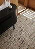 The Tribe Home nz Flint wool rug shown close up under a sideboard