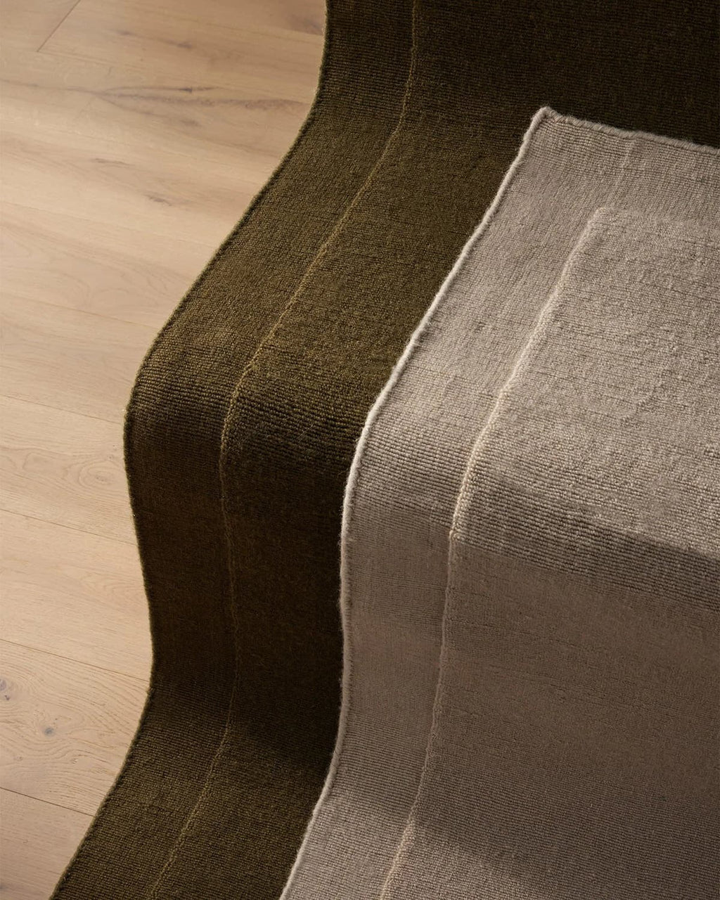 Two NZ wool rugs by Weave Home laid out on stairs 