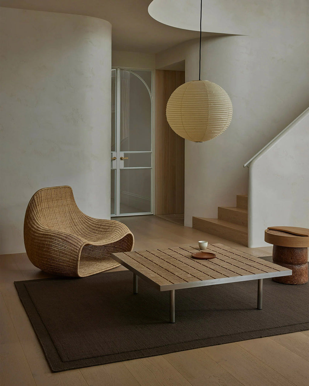 Stylish living room featuring wooden furniture and a Weave Home chocolate brown NZ wool floor rug