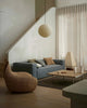 Modern living room setting wih blue couch and stylish weave home cushions