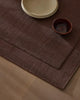 A burgundy NZ wool rug with frame feature by Weave Home