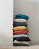 Beautiful stack of jewel-toned linen cushions by Weave Home NZ