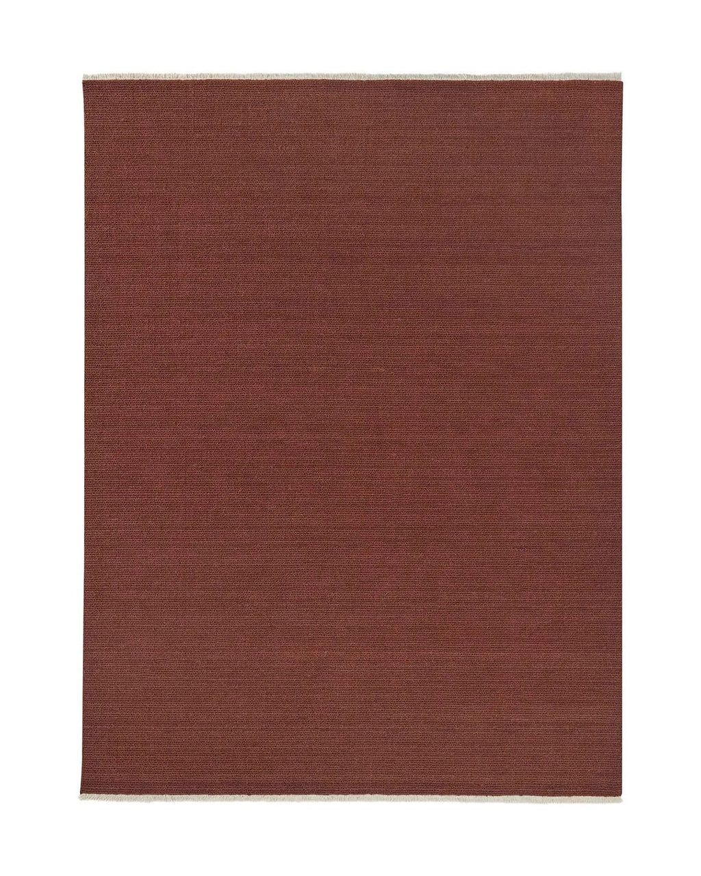 Red rectangular textural rug with cream fringing on a white background
