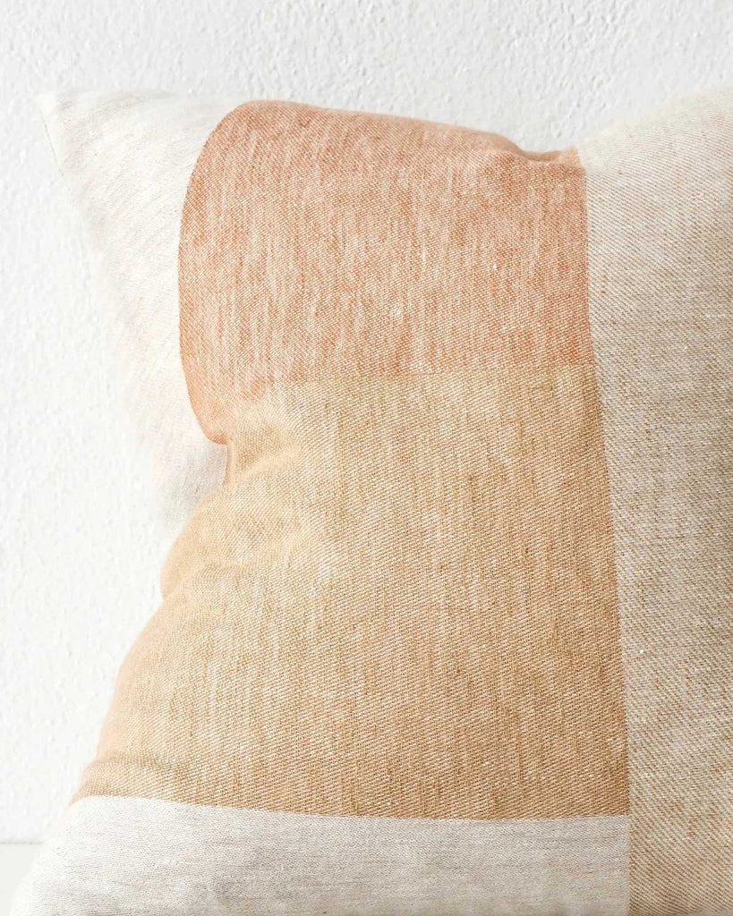 Close up of a geometric cushion in earthy tones by Weave Home AU