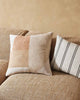 The Erina geometric cushion by Weave Home, sitting next to the striped Vinnie cushion