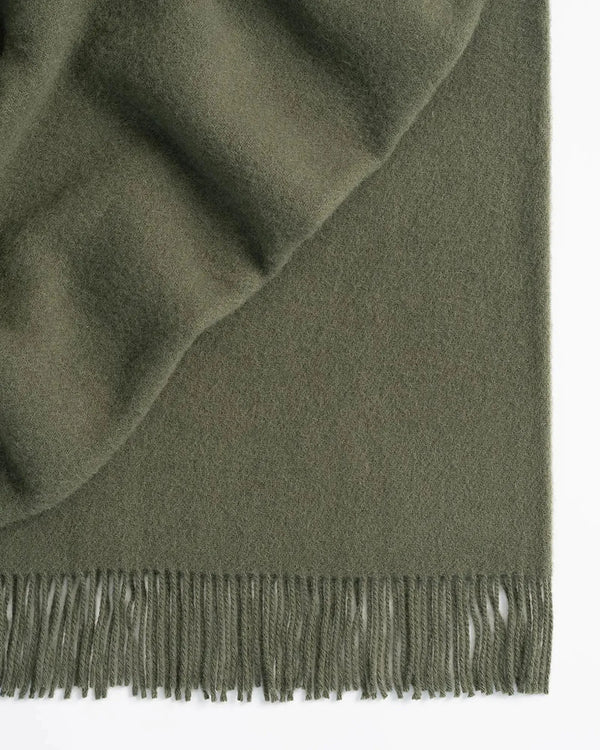 Weave Home wool throw blanket in colour 'juniper' - an on-trend muted green