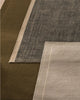 Weave Home NZ wool Close-up of three different textured rugs in brown, navy, and sand