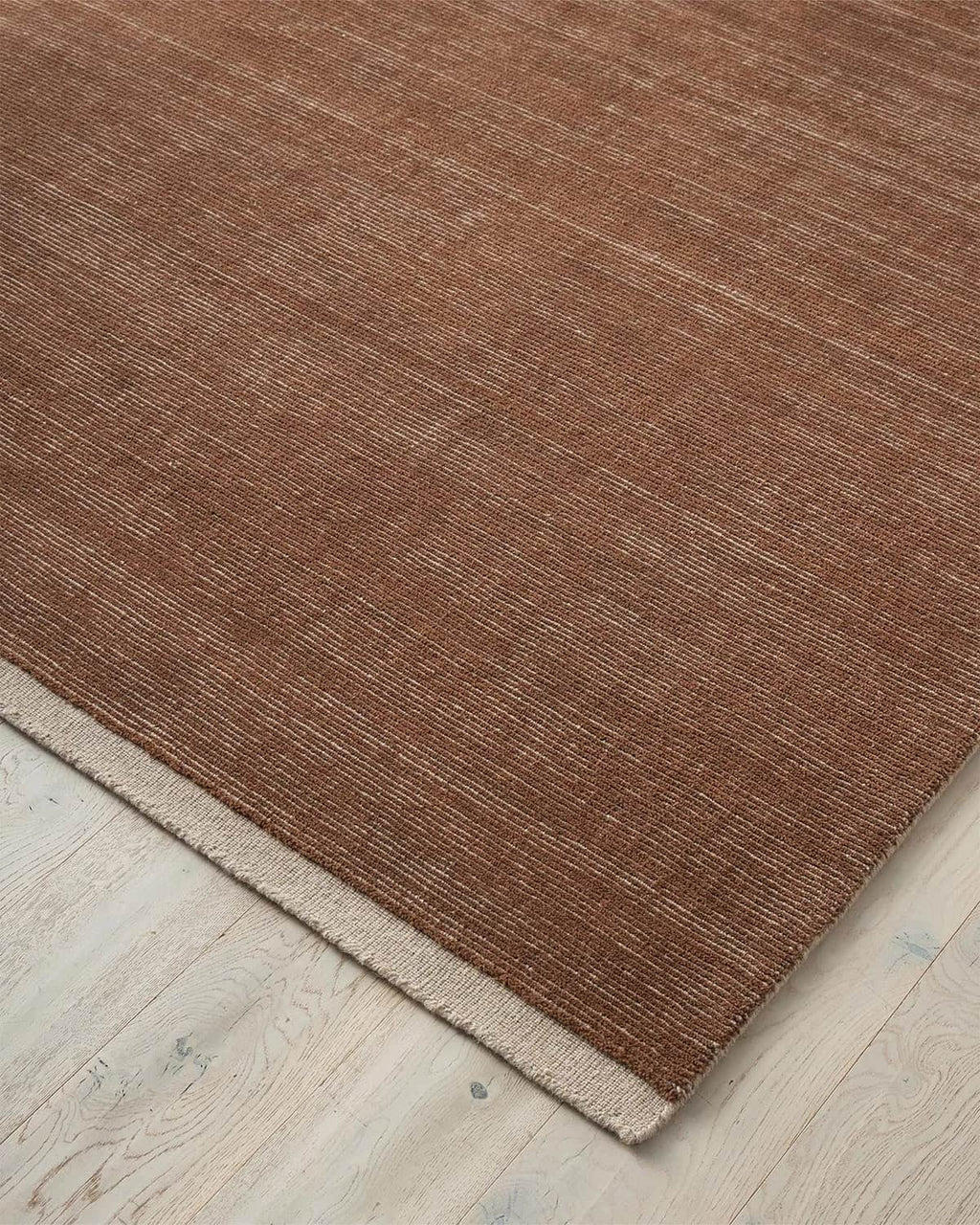 Weave Home NZ wool amber brown rug corner detail