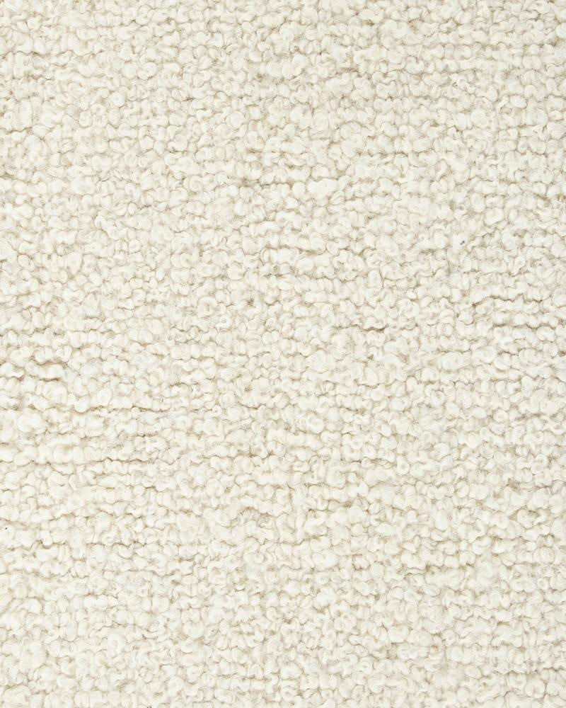 Extreme close up of a light creamy-white wool floor rug with a boucle style weave - the Dorset natural White by Baya