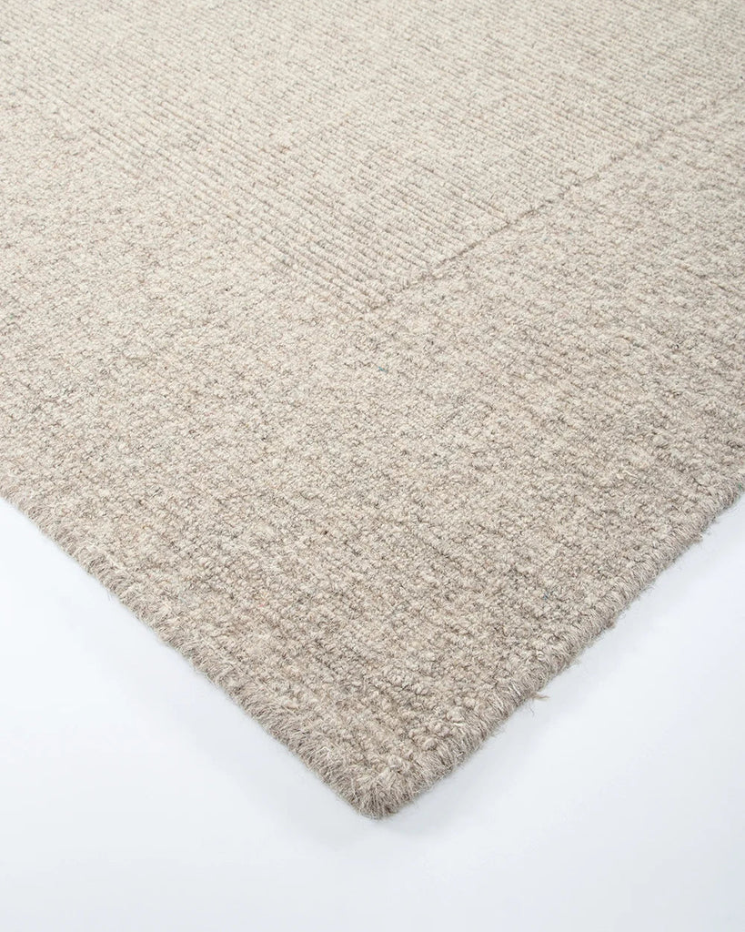 Corner close up of the Baya 'Vermont' wool floor rug in colour 'Driftwood'