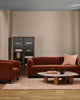 Baya Alden linen cotton blend cushion in Clay, styled on a rust velvet sofa