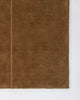 Baya Bastion NZ wool floor rug in Hazelnut, close view of a corner showing the pile and a fine lengthwise line.