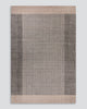 Baya Bedrock Indoor and Outdoor Floor Rug in Zinc, full flat-lay product shot on a plain grey background showing the charcoal-grey field with darker charcoal side stripes and a pale sand border top and bottom.