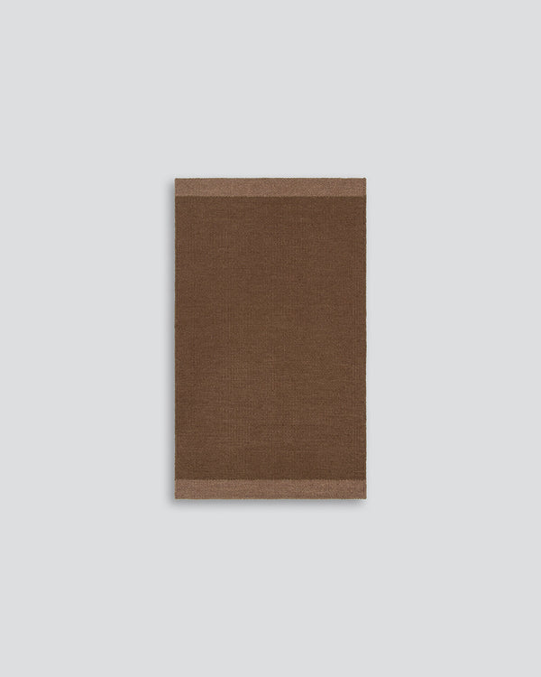 Baya Carla NZ wool floor mat in Cocoa, full flat view on a plain background.