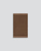 Baya Carla NZ wool floor mat in Cocoa, full flat view on a plain background.