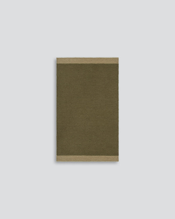 Baya Carla NZ wool floor mat in Military, full flat view on a plain background.