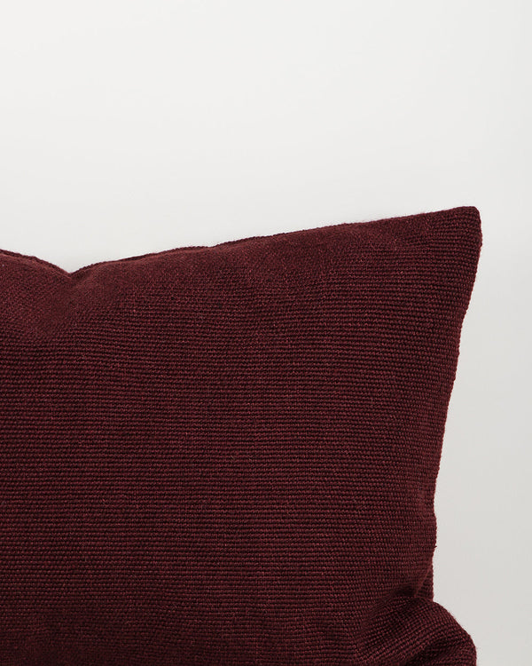 Close-up of the trim on the Baya Clipper recycled PET outdoor lumbar cushion in Claret