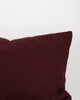 Close-up of the trim on the Baya Clipper recycled PET outdoor lumbar cushion in Claret