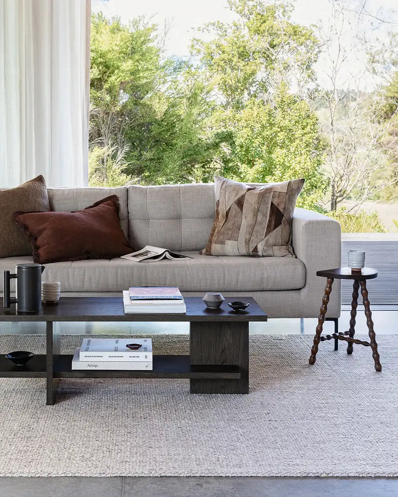 Baya cushions in brown tones, including the Dover Brick', on a couch in a stylish nz home