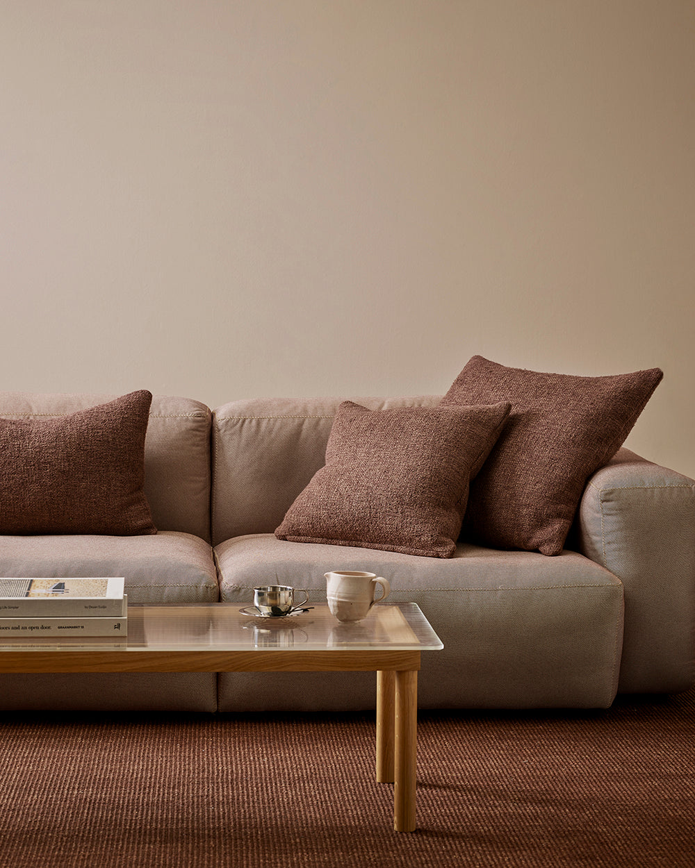Baya Cyprian cushion in Espresso, side profile showing the filled shape.
