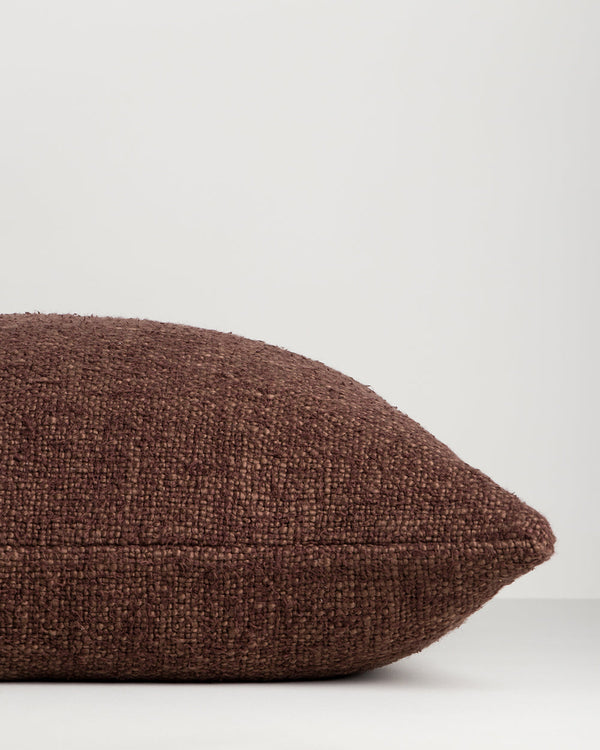 Baya Cyprian lumbar cushion in Espresso, close view of the handwoven texture and edge.