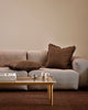 Baya Dover Chocolate cushion styled on a neutral grey sofa, shown with a smaller lumbar cushion