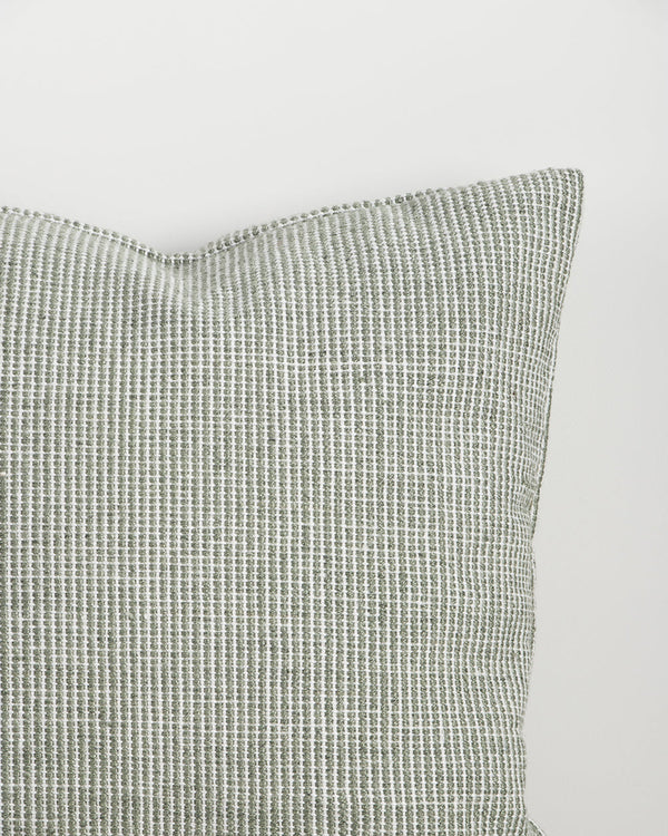 Close-up of the corner and weave texture on the Baya Dune outdoor cushion in Eucalyptus